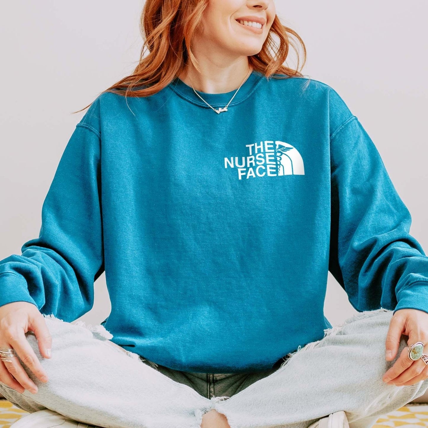 The Nurse Face Sweatshirt – Cozy North Face-Inspired Crewneck for Nurses
