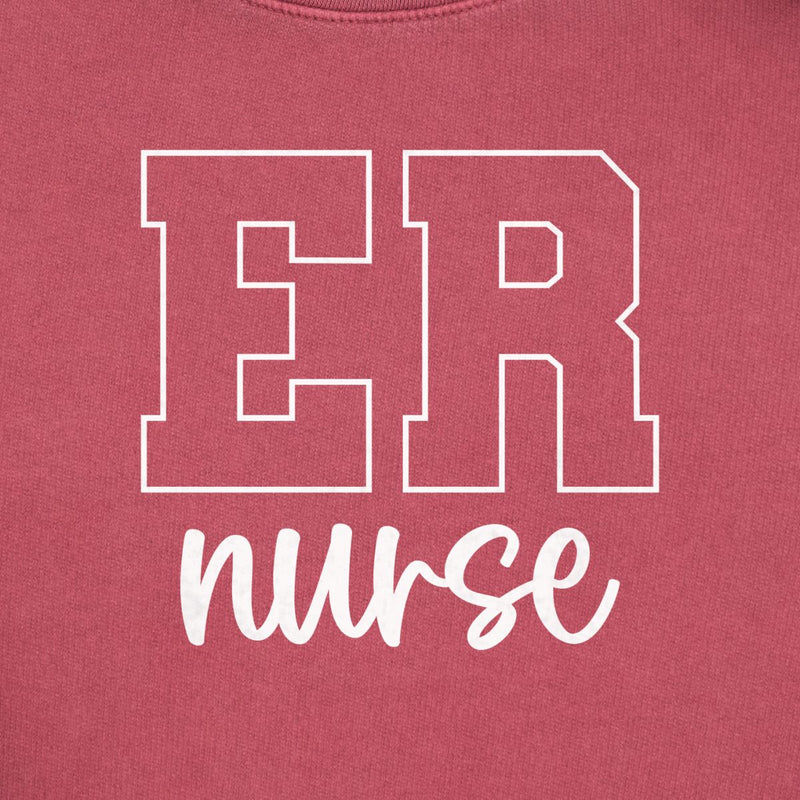 ER Nurse Varsity Crewneck in Crimson, close-up of the white varsity-outline "ER" with script "nurse" print on a folded crewneck