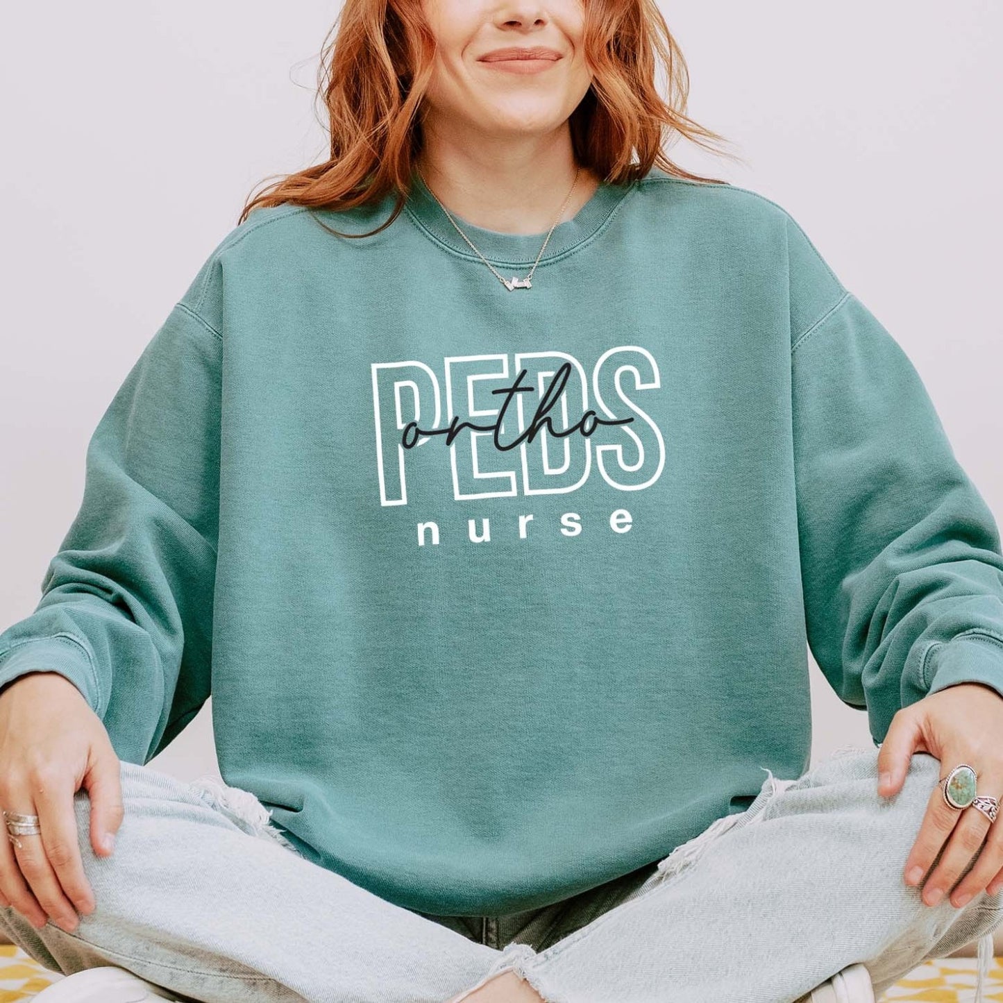 PEDS Ortho Nurse Sweatshirt – Bold Layered Text Design for Pediatric Nurses