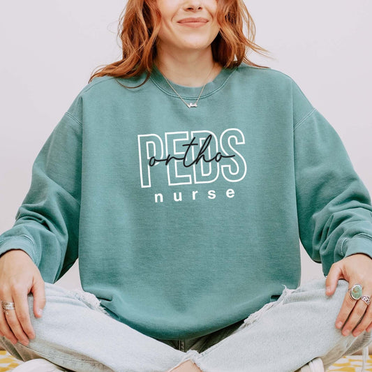 PEDS Ortho Nurse Sweatshirt – Bold Layered Text Design for Pediatric Nurses