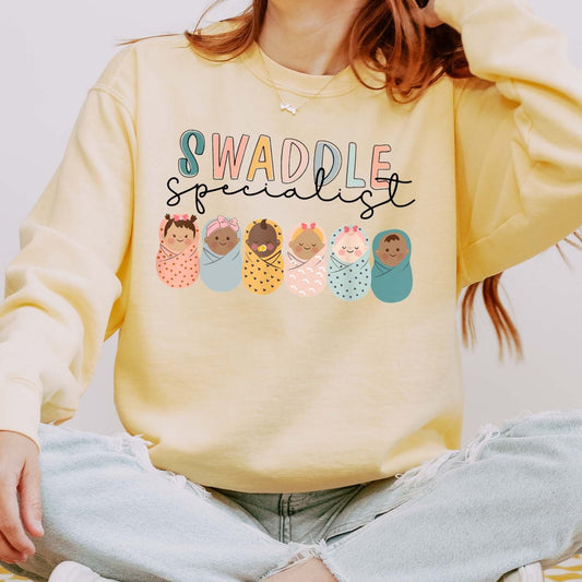 Swaddle Specialist Sweatshirt – Crewneck for Baby-Loving Nurses
