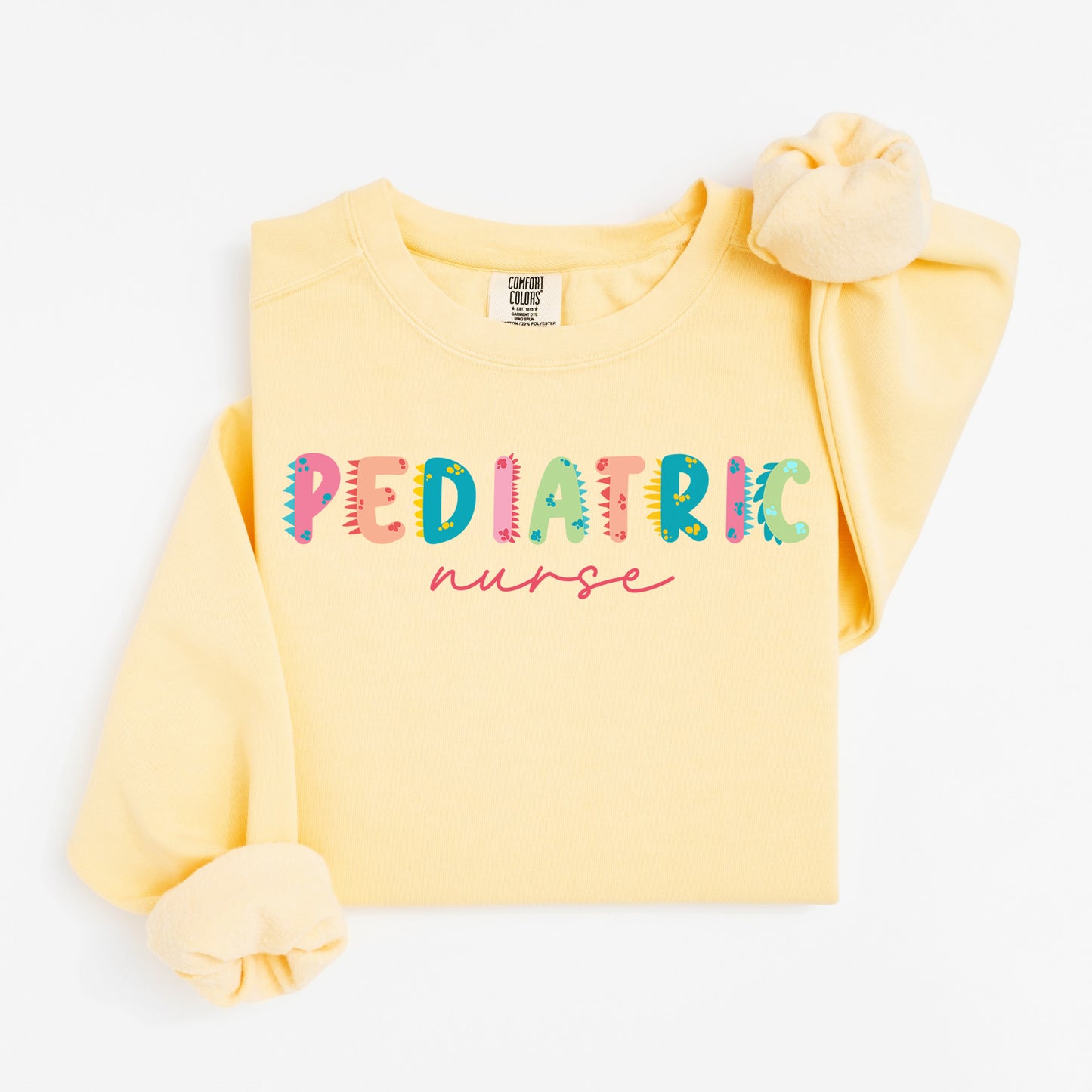 Cute Dino Pediatric Nurse Sweatshirt – Fun Dinosaur Lettering for Kid-Loving Nurses