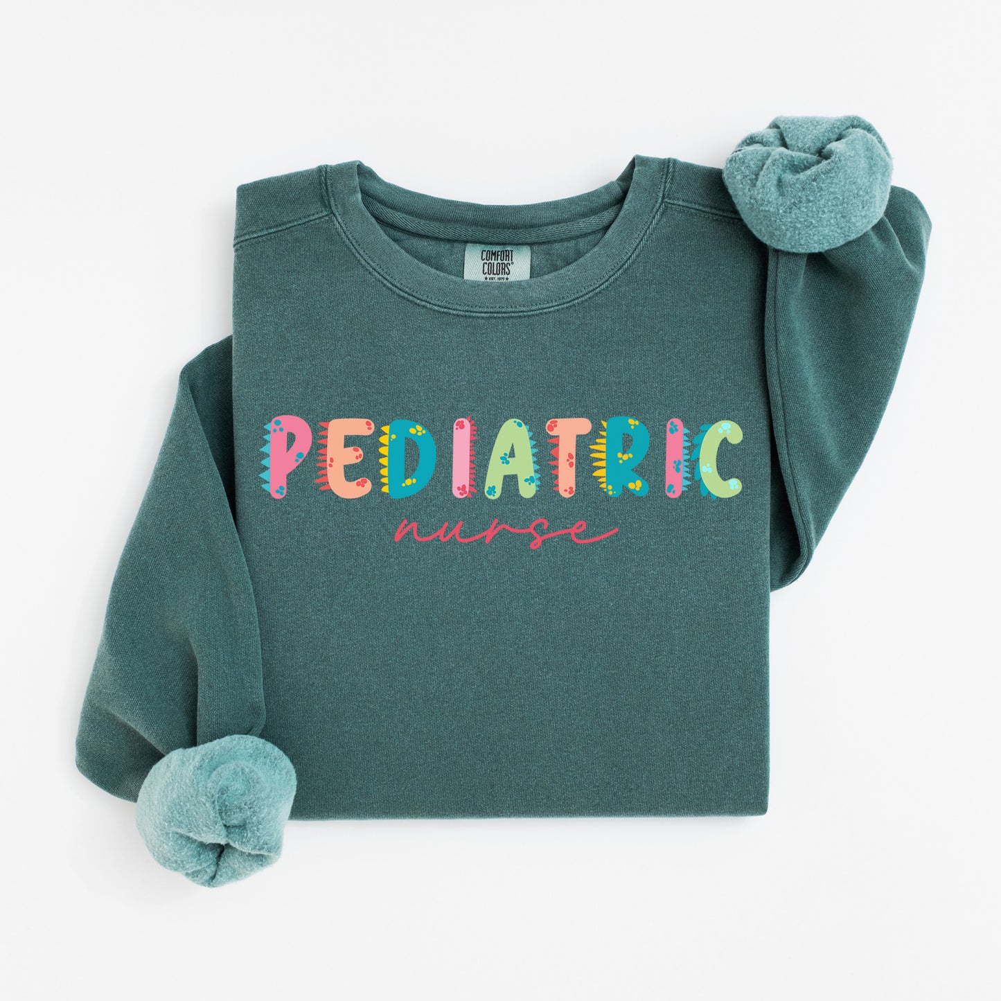 Cute Dino Pediatric Nurse Sweatshirt – Fun Dinosaur Lettering for Kid-Loving Nurses
