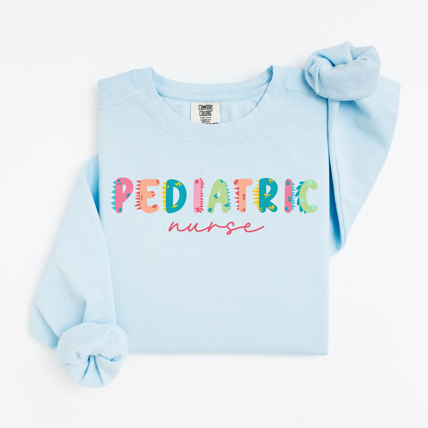 Cute Dino Pediatric Nurse Sweatshirt – Fun Dinosaur Lettering for Kid-Loving Nurses