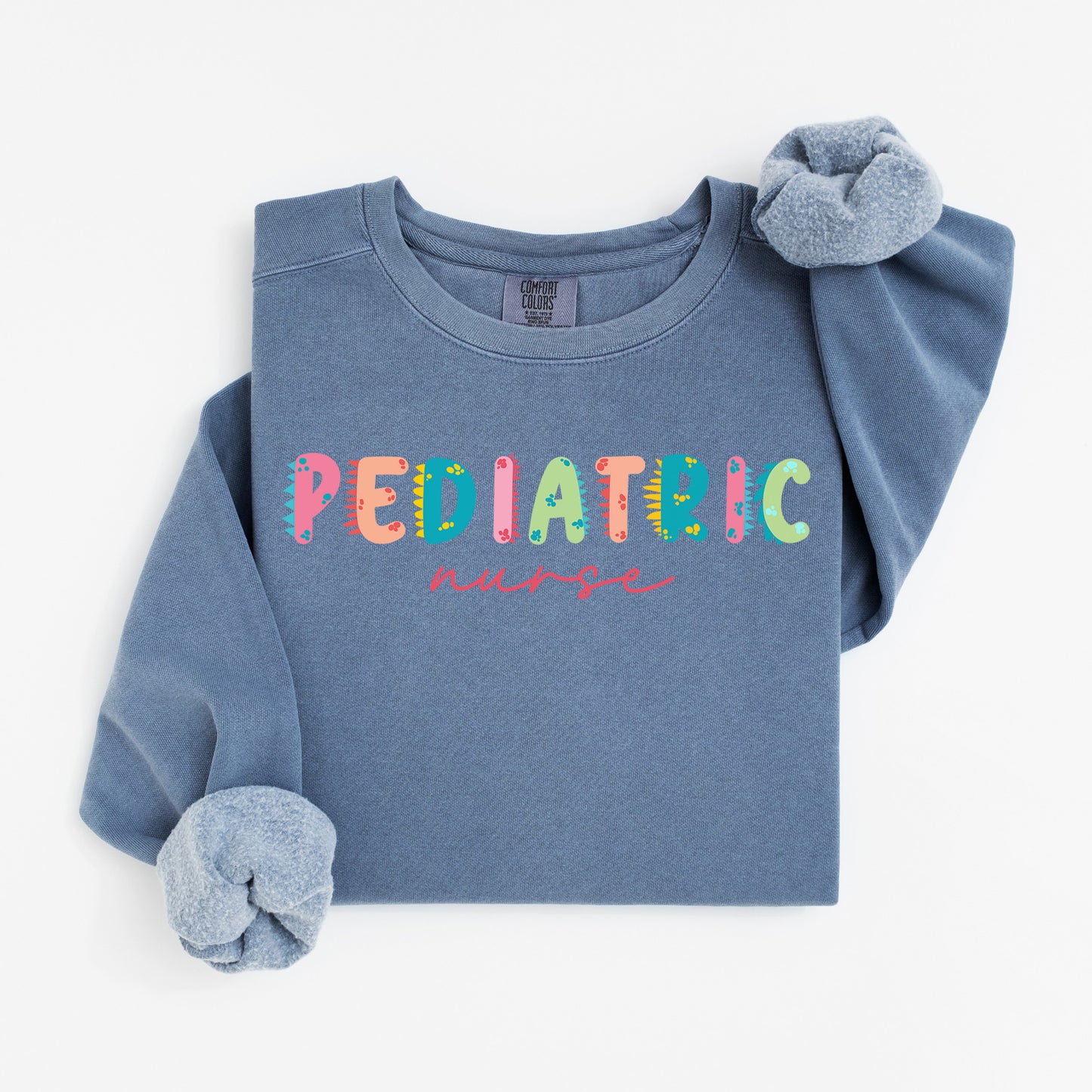 Cute Dino Pediatric Nurse Sweatshirt – Fun Dinosaur Lettering for Kid-Loving Nurses