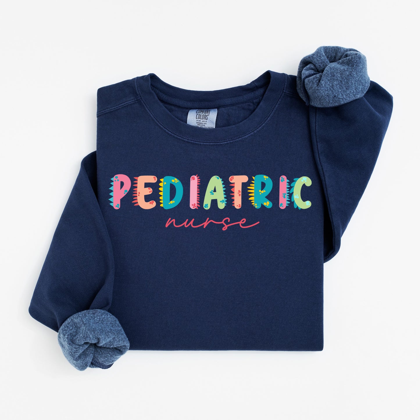 Cute Dino Pediatric Nurse Sweatshirt – Fun Dinosaur Lettering for Kid-Loving Nurses