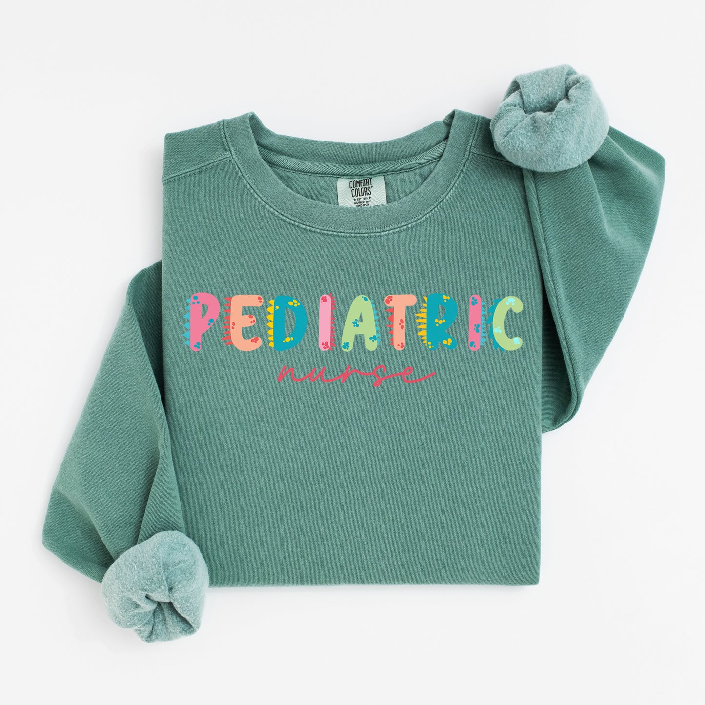 Cute Dino Pediatric Nurse Sweatshirt – Fun Dinosaur Lettering for Kid-Loving Nurses