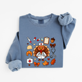 Blue Jean Cute Turkey Nurse Thanksgiving sweatshirt flat lay, turkey nurse in a white coat surrounded by nurse and fall icons, Comfort Colors 1466