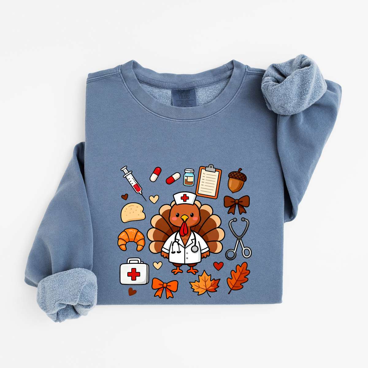 Blue Jean Cute Turkey Nurse Thanksgiving sweatshirt flat lay, turkey nurse in a white coat surrounded by nurse and fall icons, Comfort Colors 1466