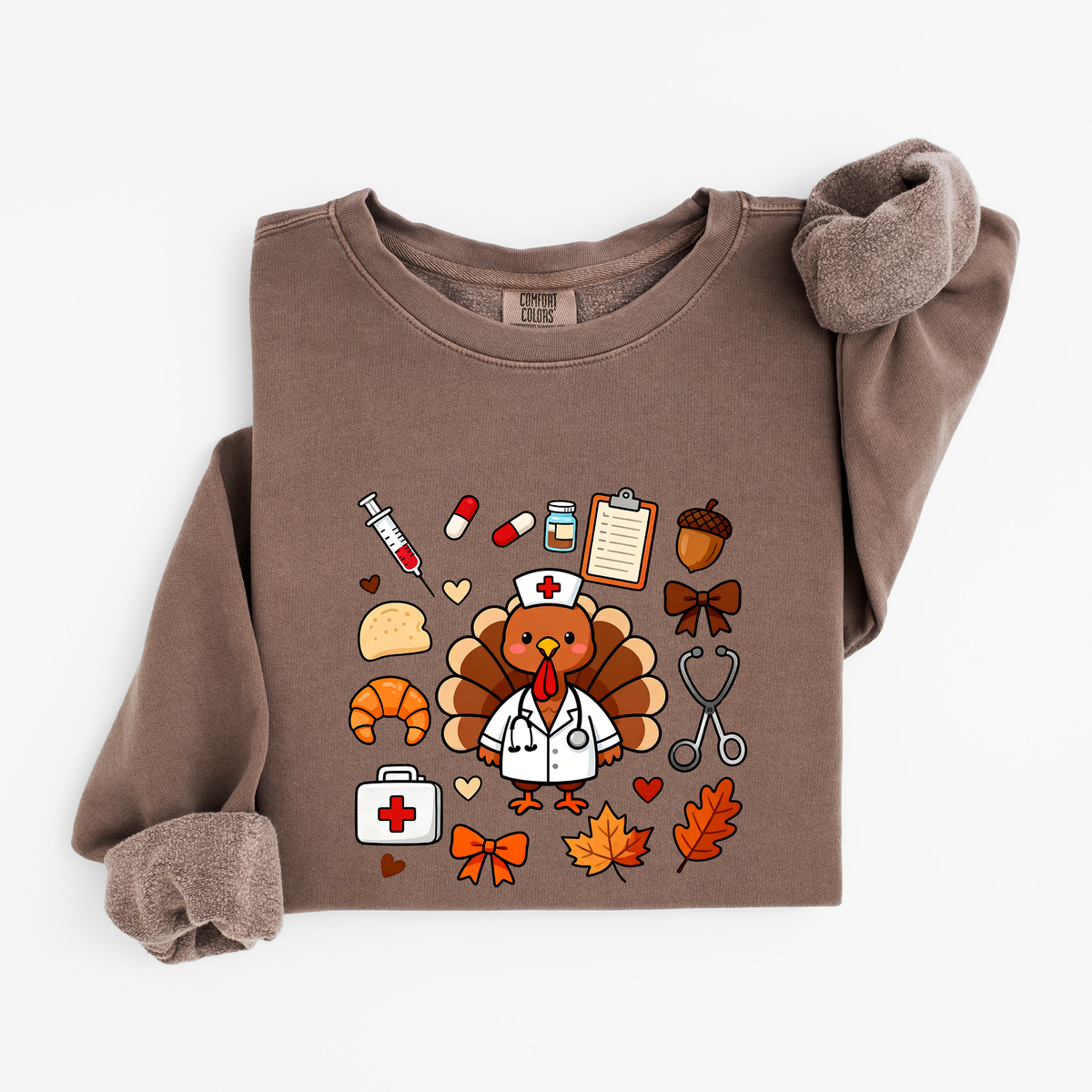 Espresso Cute Turkey Nurse Thanksgiving sweatshirt flat lay, turkey nurse in a white coat surrounded by nurse and fall icons, Comfort Colors 1466
