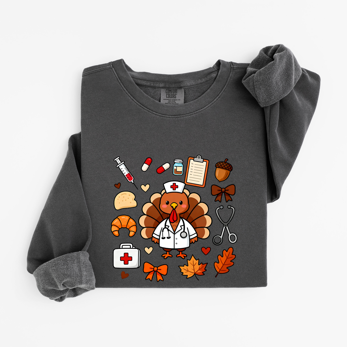 Pepper Cute Turkey Nurse Thanksgiving sweatshirt flat lay, turkey nurse in a white coat surrounded by nurse and fall icons, Comfort Colors 1466