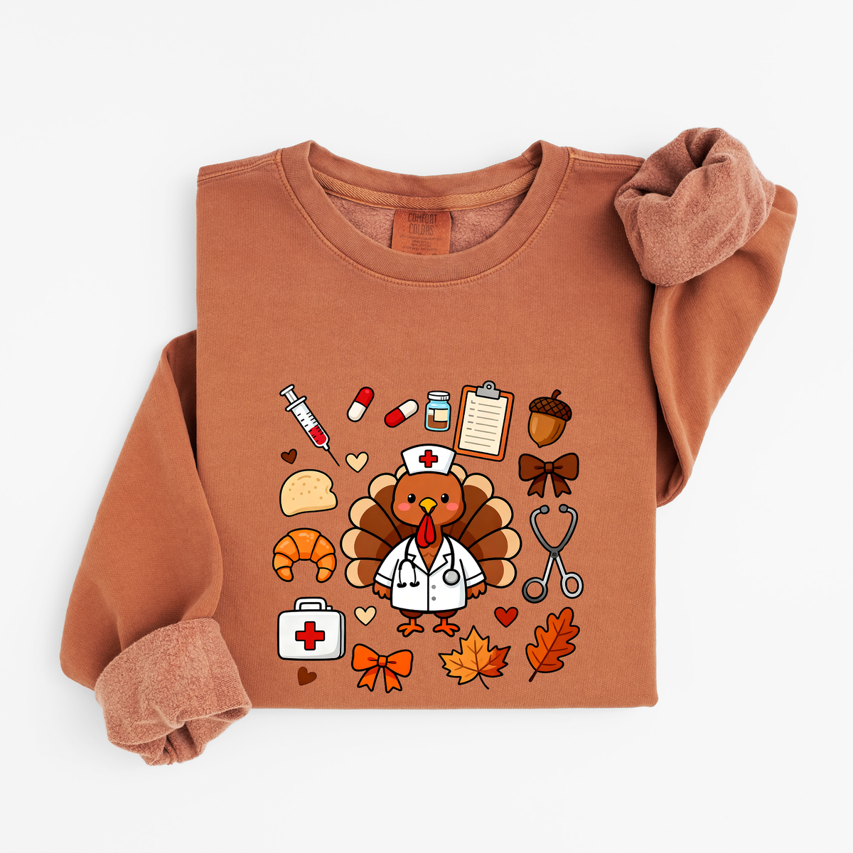 Yam Cute Turkey Nurse Thanksgiving sweatshirt flat lay, turkey nurse in a white coat surrounded by nurse and fall icons, Comfort Colors 1466
