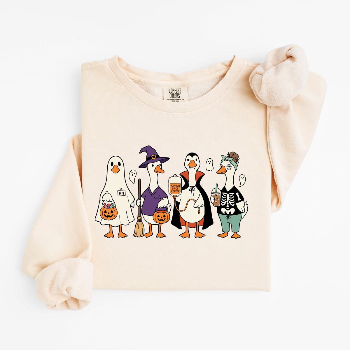Ivory Halloween Nurse Geese sweatshirt flat lay, ghost, witch, Dracula and skeleton nurse geese, Comfort Colors 1466