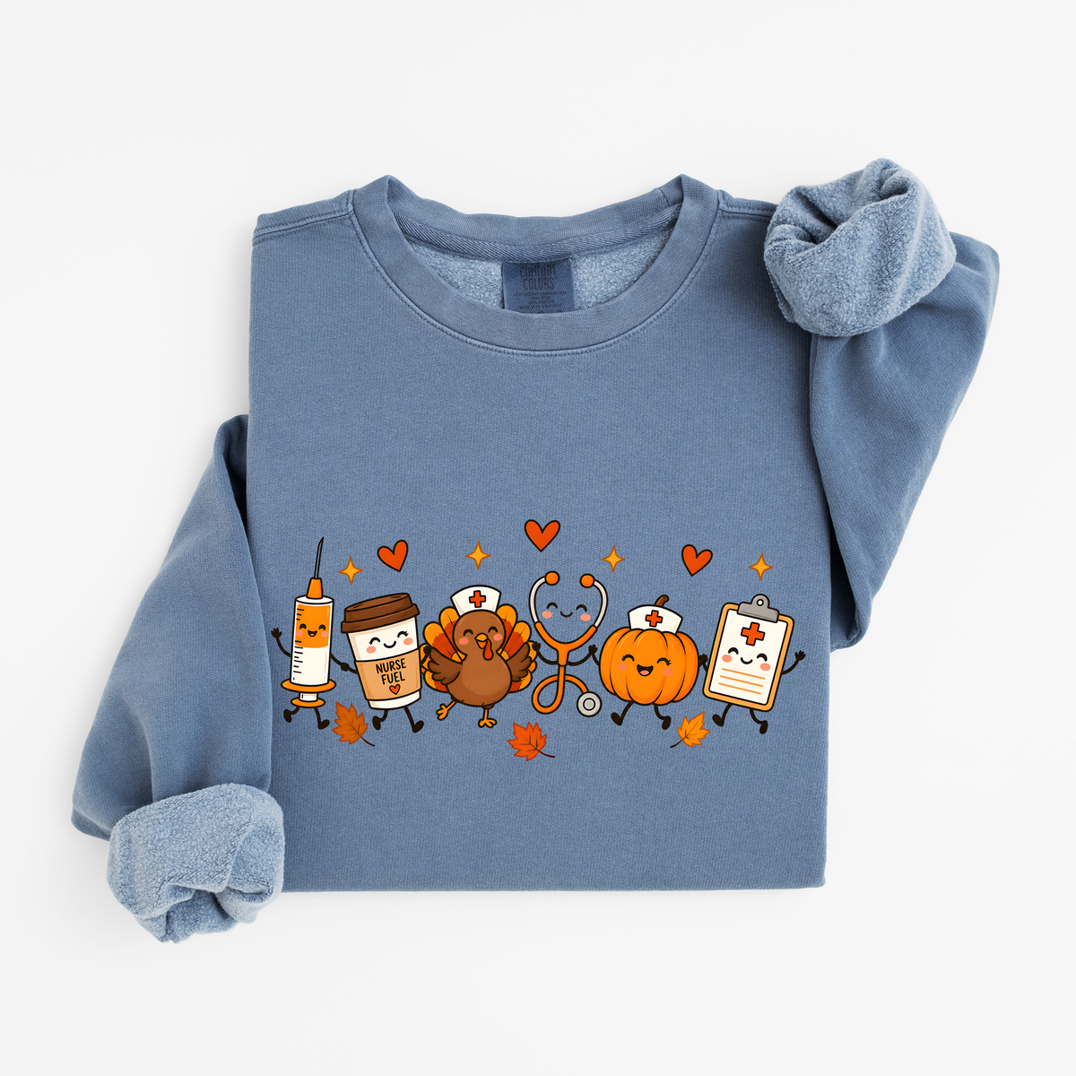 Blue Jean Thanksgiving Nurse Friends sweatshirt flat lay, turkey, pumpkin, Nurse Fuel coffee, syringe, stethoscope and clipboard characters, Comfort Colors 1466